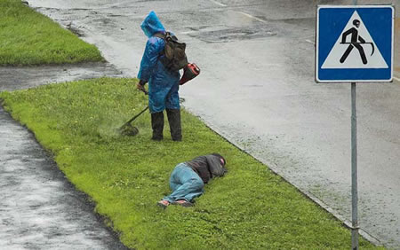 Funny Picture - Weed Whacking Around A Bum