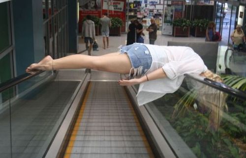 Funny Picture - One Way To Ride An Escalator