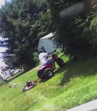 Funny Picture - Redneck Riding Lawnmower